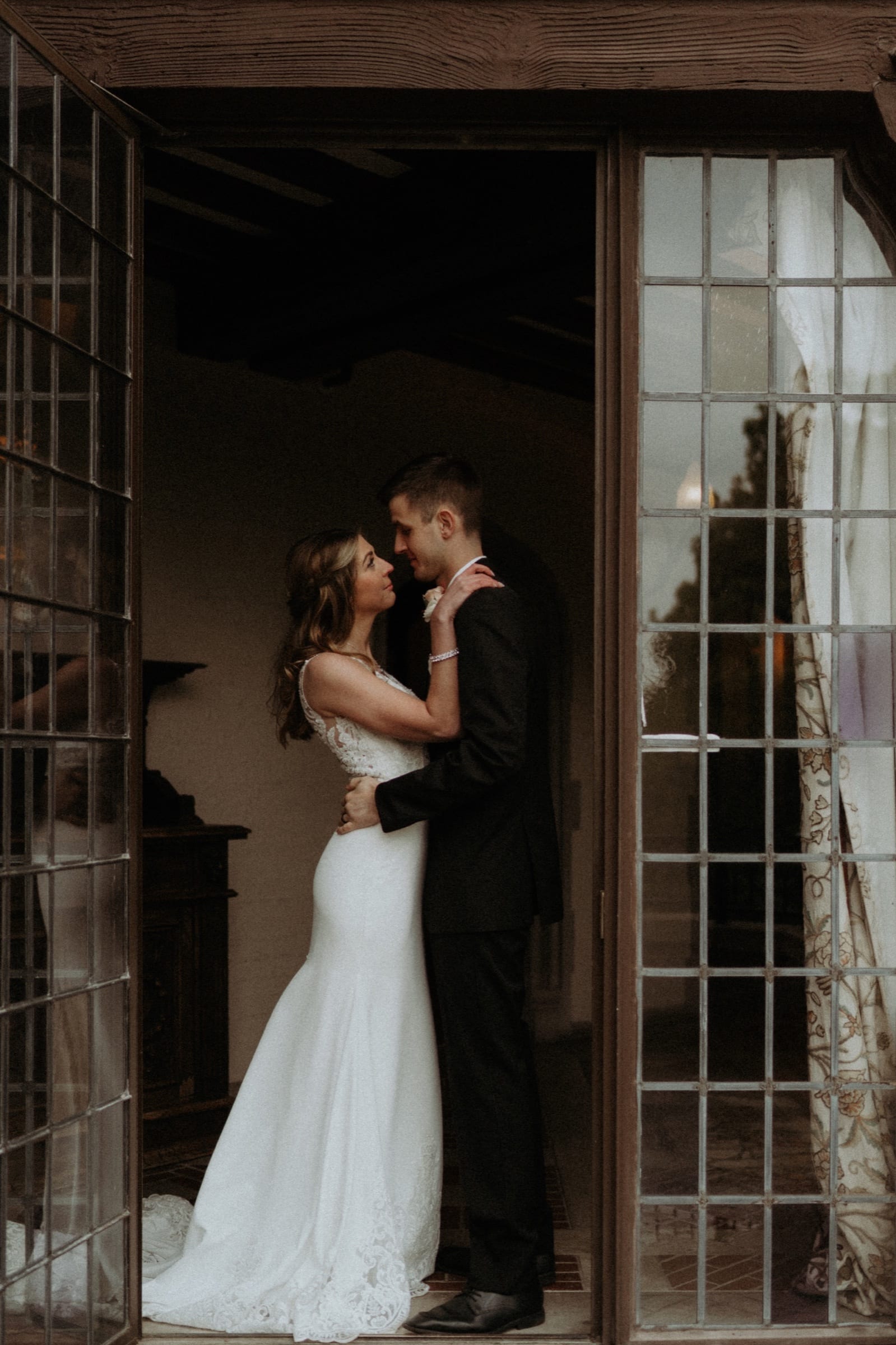 Candid wedding moment from Erik and Paige's wedding at Rollins Mansion