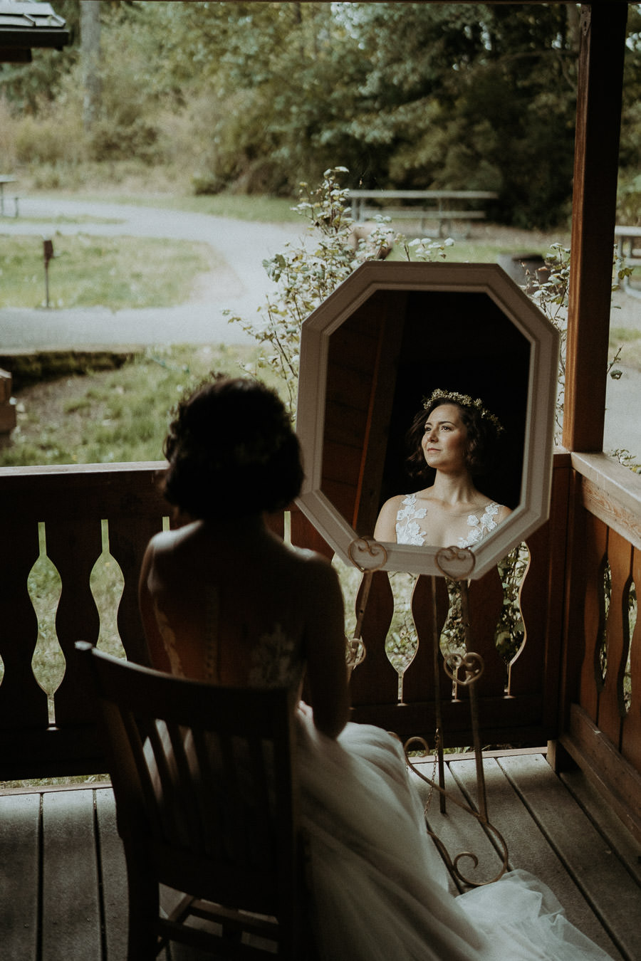 A bride reflected in a cabin mirror