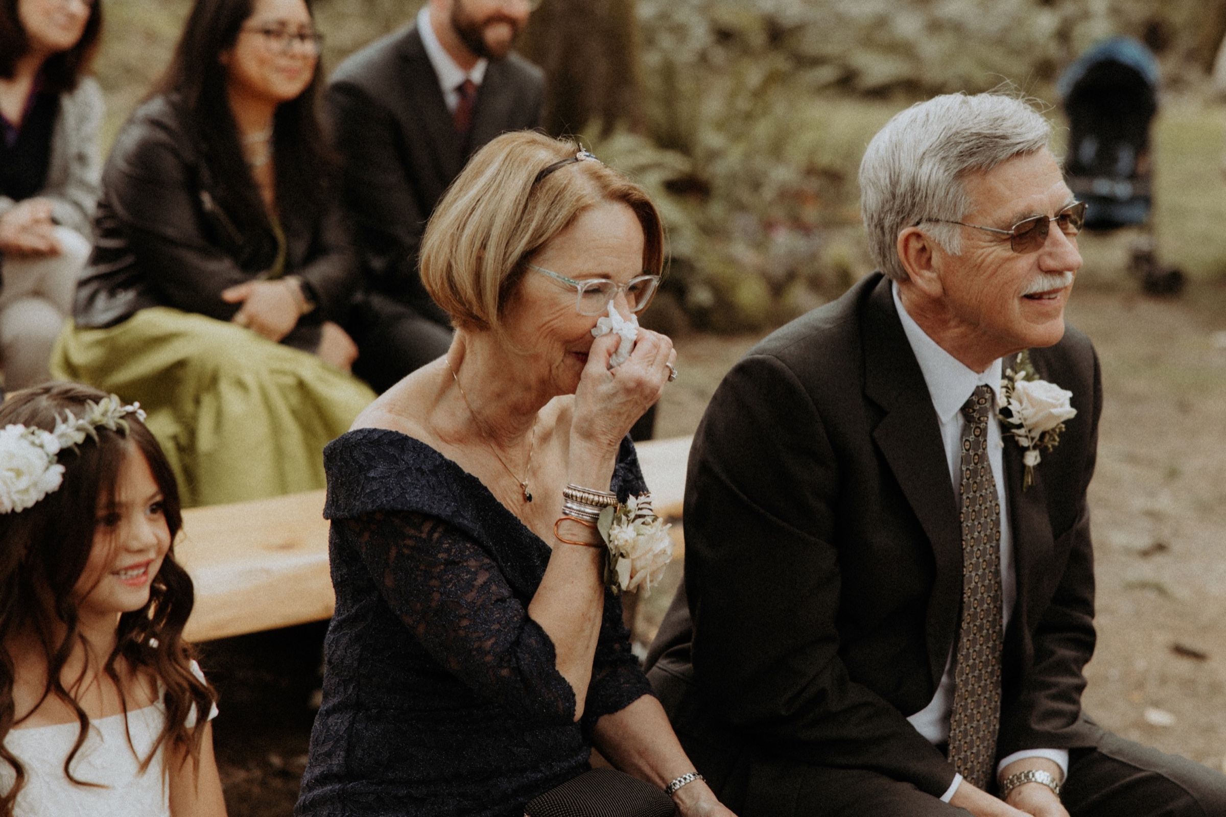 Parents reacting emotionally at a wedding ceremony